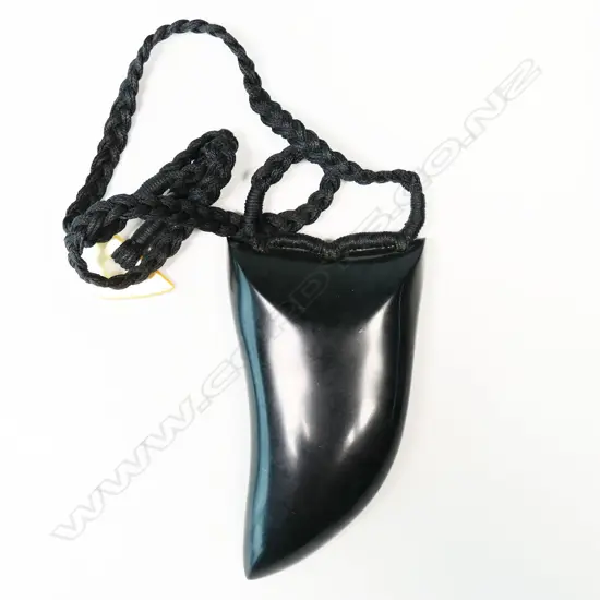 Te Kaha large carved pounamu rei niho (eye tooth) pendant,